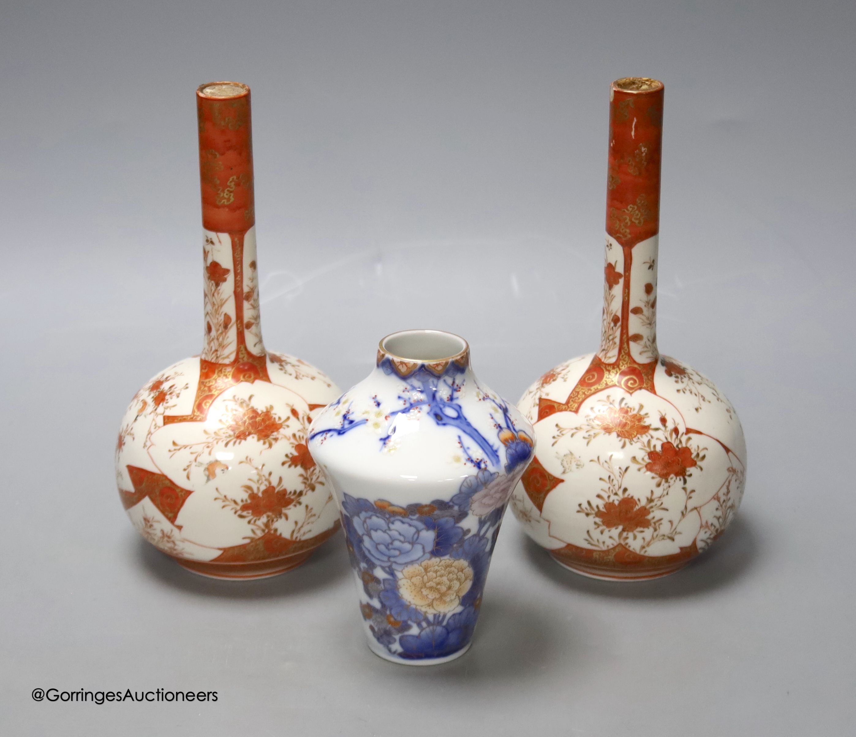 A Japanese porcelain vase, by Fukugawa and two Kutani bottle vases, height 21cm